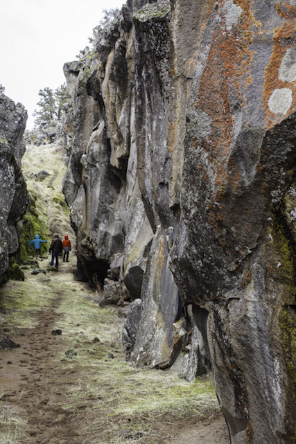 Crack in the Ground is a two-mile long fissure in the surface of the earth, caused by eruptions in the Four Craters lava Field thousands of years ago. At its deepest, the walls reach 70 feet high giving it a lower average temperature for the region. The hiking trailhead is located 7 miles north of Christmas Valley, Oregon. Photo by Rob Kerr
