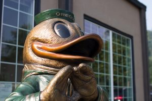 Allison Brown with Oregon Duck Bronze Sculpture